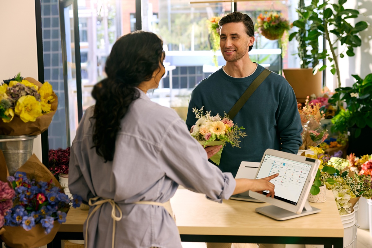 customer transacting at a flower shop